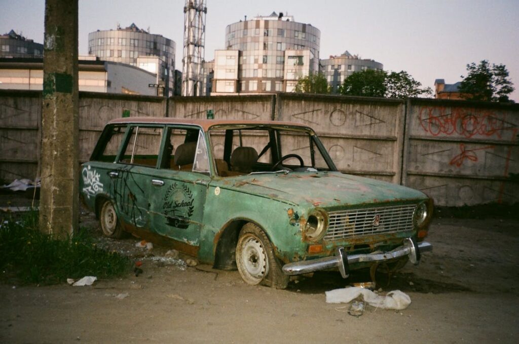 Old and damaged abandoned vehicle.