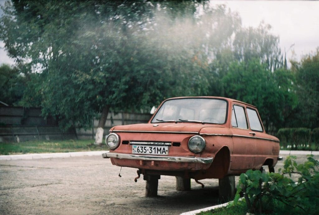 Rundown vehicle parked on a property.