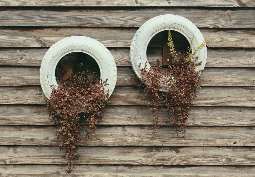 Two stack of tire planters hanging.