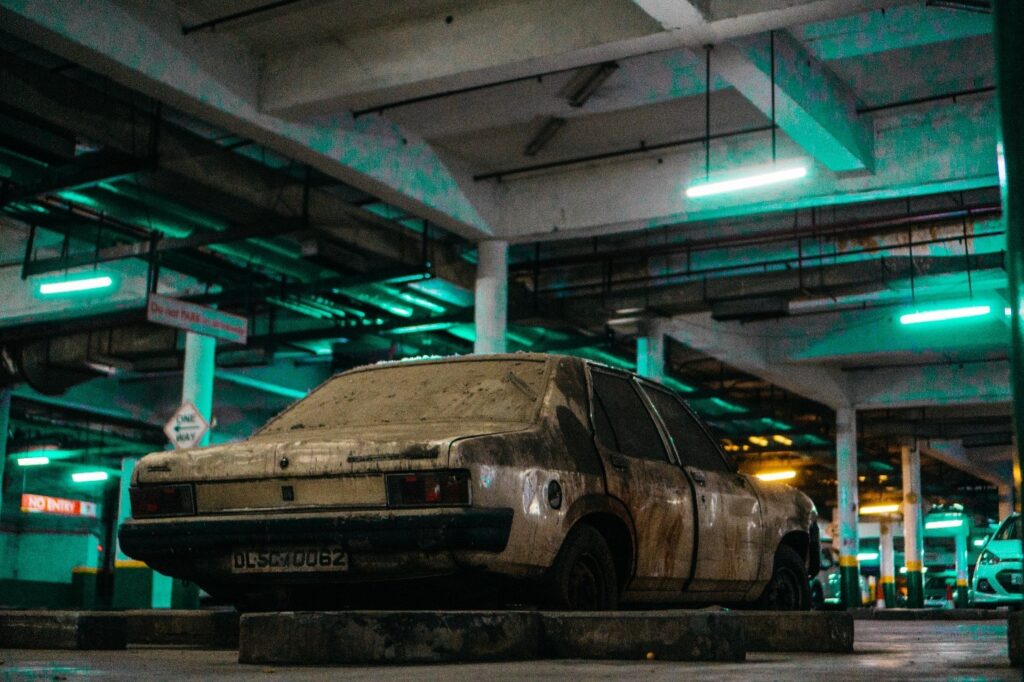 A scrap car in a garage