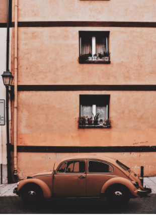 a Volkswagen parked outside a house