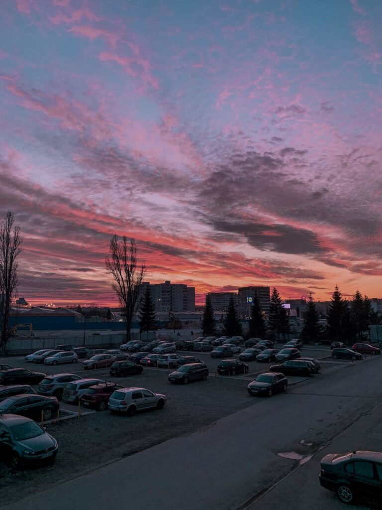 Many cars parked on a ground