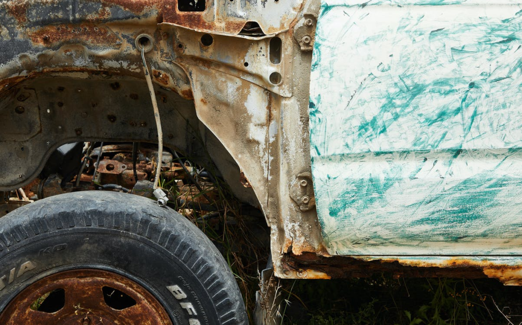 A damaged car at the junk vehicle removal junkyard