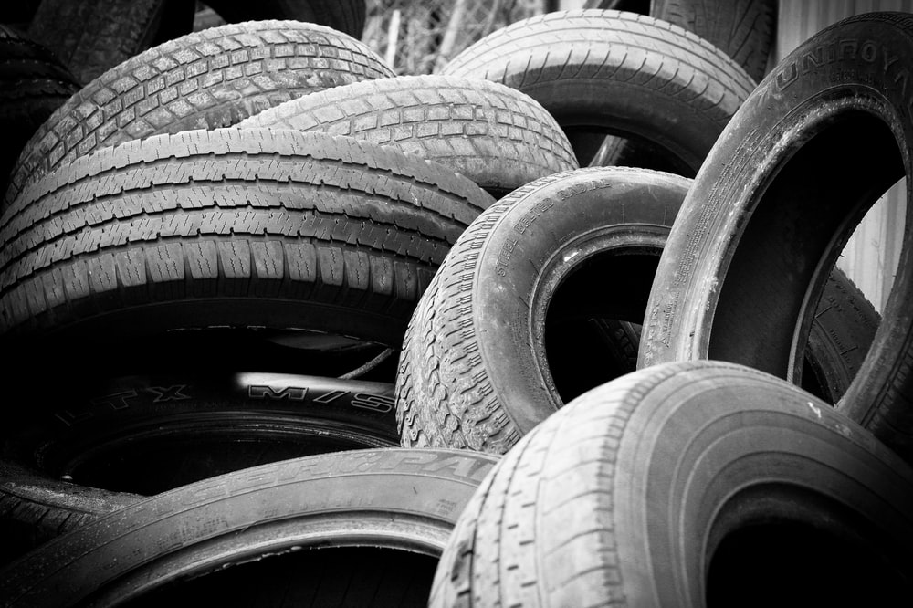 A pile of old tires of impounded junk cars