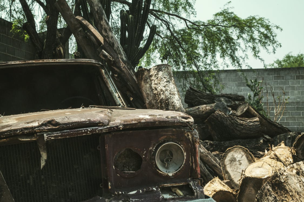 junk car parked on an old property