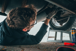 a person repairing a car