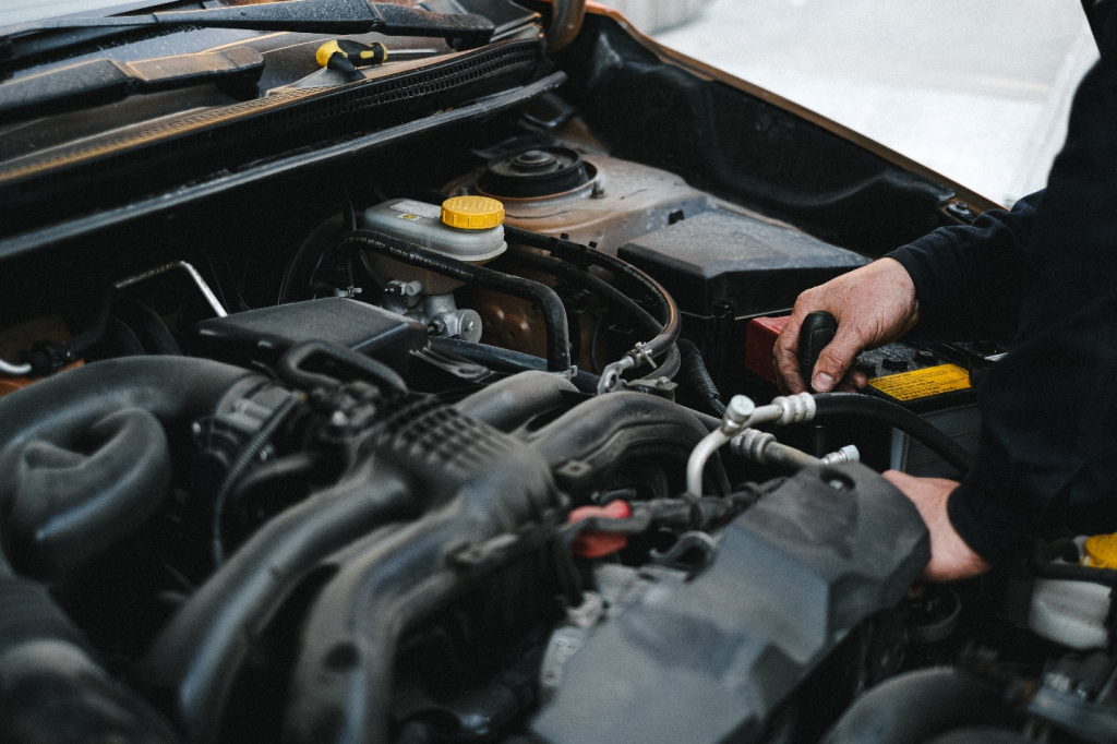 a person installing a new car engine