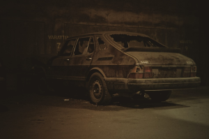 An old, beaten-up, abandoned vehicle
