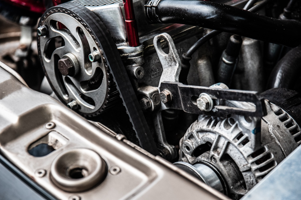 A close up photo of black and silver car engine