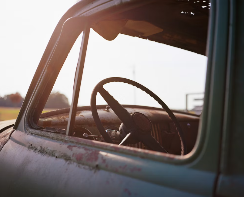 Close-up shot of an abandoned car.