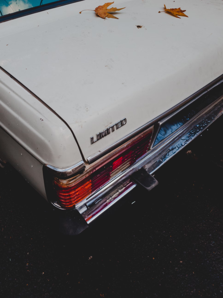 A photo showing a beige car outdoors.