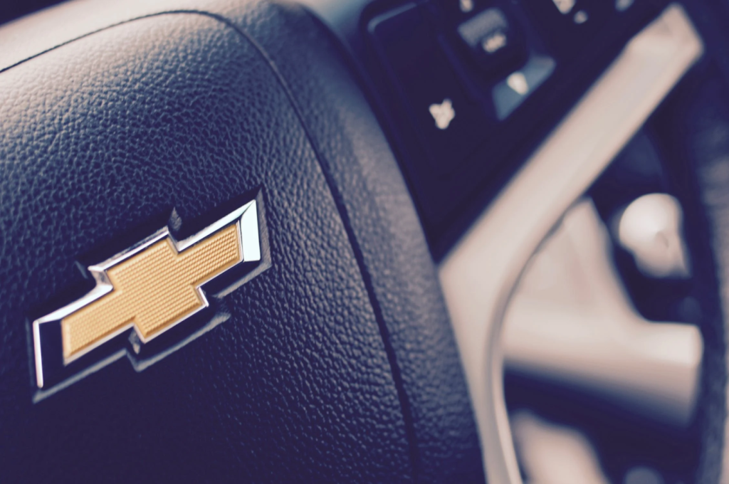 A photo showing a close-up view of a steering wheel.