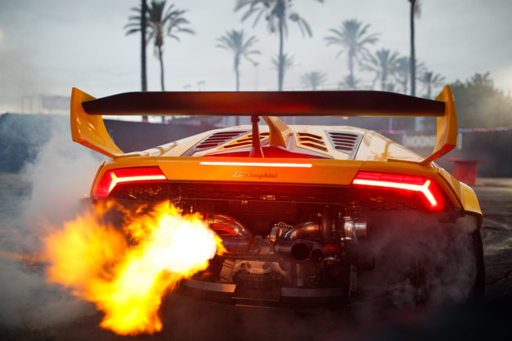 A photo showing a supercar’s exhaust emitting flames.