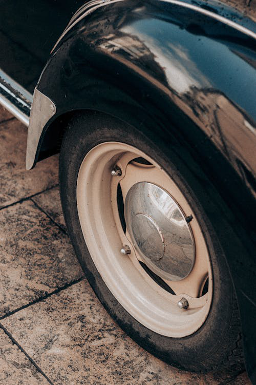 Close-up of a black tire with a chrome wheel.