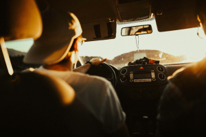 Person holding the steering wheel while driving