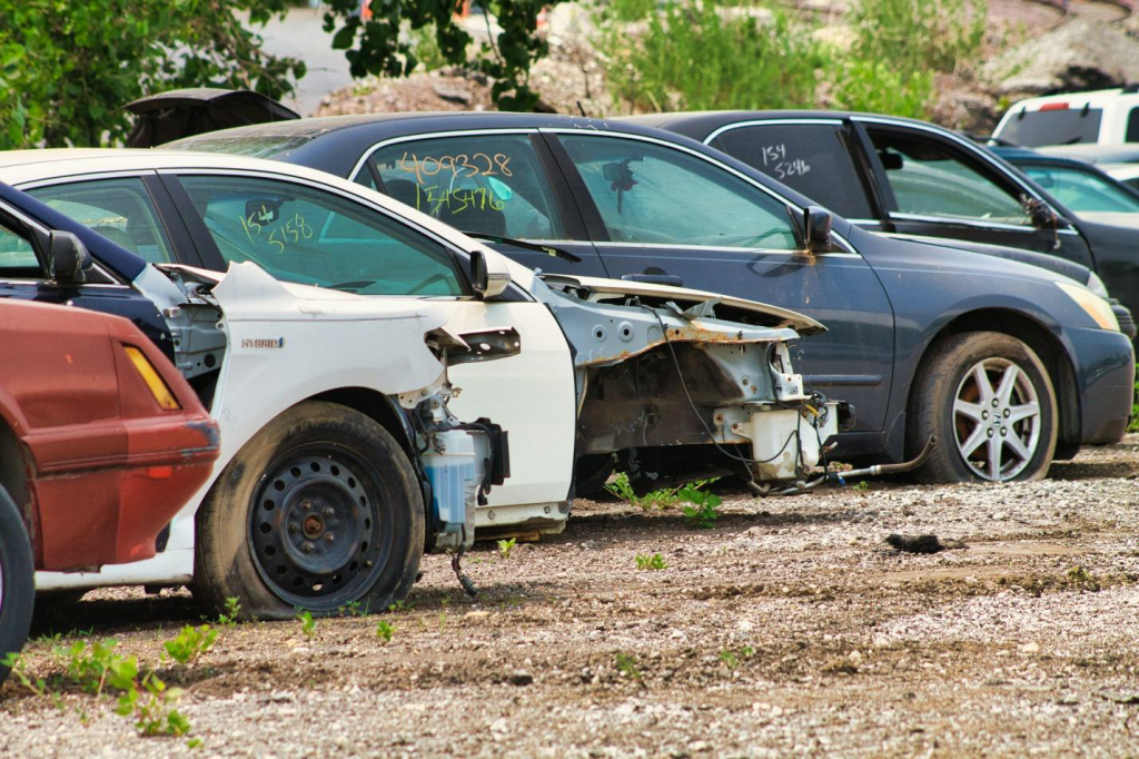 Junk cars parked in a line.