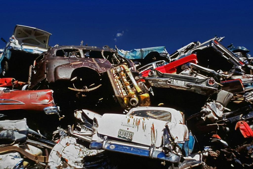 Lowered angled shot of a pile of junk cars.